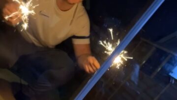 Adorable-baby-mesmerized-by-magical-fireworks-show-in-the-garden.jpg