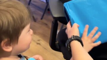 Sweet-Bonding-Moment-Autistic-Boy-Joyfully-Unwraps-Gifts-for-Mama.jpg