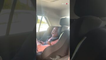 Toddler-in-stitches-as-mom-entertains-in-car-Adorable.jpg