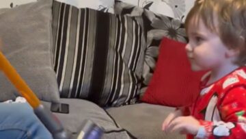 Toddler-delighted-by-mini-Dyson-Hoover-Super-Cute.jpg