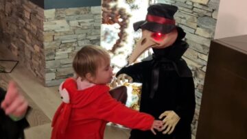 Toddler-fearlessly-plays-with-creepy-Halloween-characters-Adorable.jpg