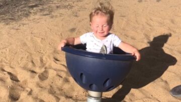 Toddler-hilariously-spins-on-park-seat-cutely-struggles-to-balance.jpg