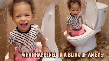 Toddler-hilariously-standing-in-toilet-seat-Adorable.jpg