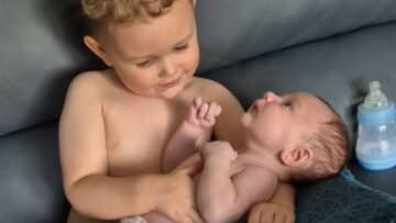 Toddlers-Adorable-Reaction-to-Baby-Brothers-Surprise-During-Cuddle-Time.jpg