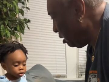 Dad-and-toddler-engage-in-cute-battle-Adorable.jpg