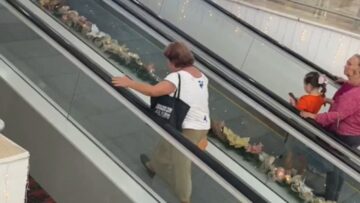 Epic-Showdown-on-the-Moving-Walkway-Shes-Going-Up-Its.jpg