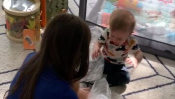 Sweet-toddler-burst-into-giggles-as-mom-pops-packing-bubbles.jpg