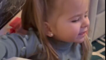 Little-Girl-Adorably-Stuck-in-Toy-Bus-Cute.jpg
