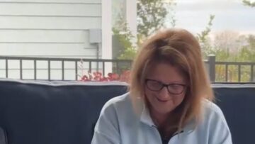 Son-Surprises-Mom-with-Tesla-a-Heartfelt-Book-Gift.jpg